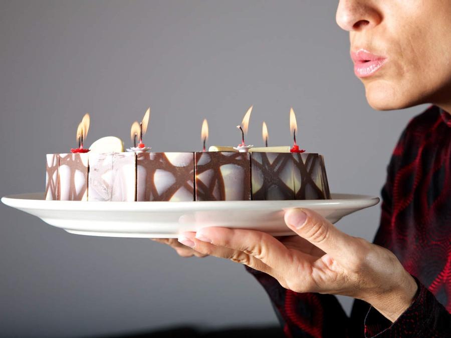 Why do we put candles on top of a birthday cake?